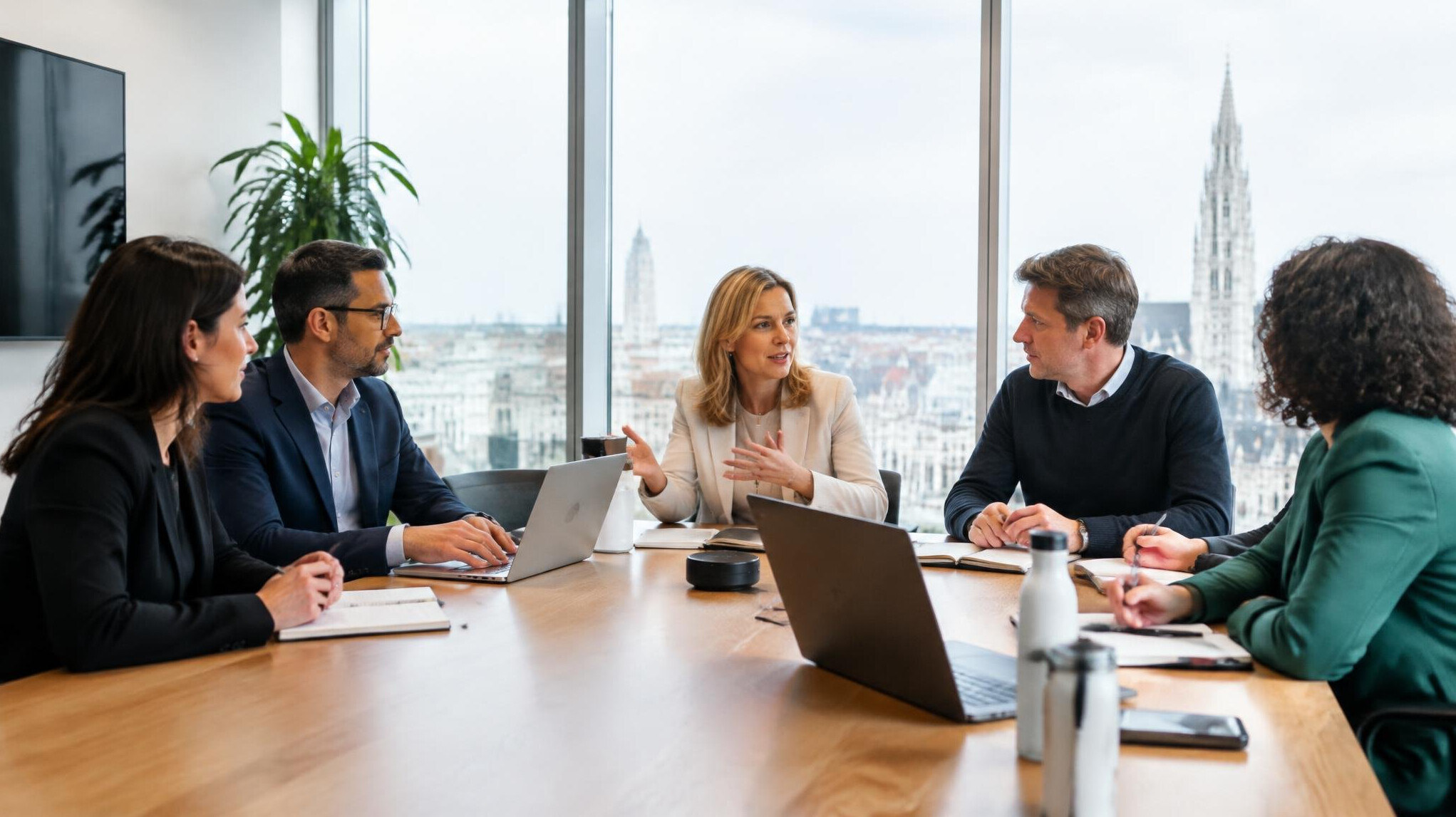 Business professionals discussing organizational trends in a modern conference room