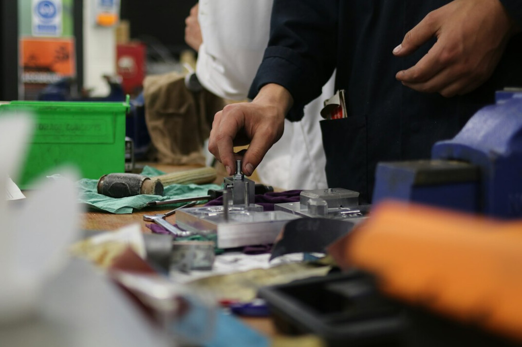 Colleagues collaborating during a workshop session at a business meeting